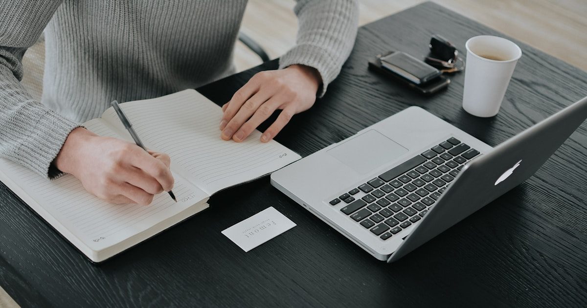 Small business owner reviewing LLC formation paperwork on a laptop